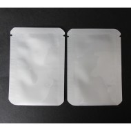 Two 2.375" x 3.375" silver MylarFoil bottom loading 3-side seal pouches with tear notch