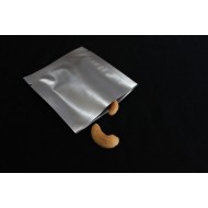 single silver foil 3 side seal pouch with two cashews sticking out