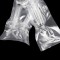 3.5" x 8.5" OD Clear 3 Side Seal Pouch with Semicircle Lip and Tear Notch (1,000/case) - 48MT035085NSTN