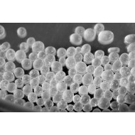 white desiccant beads on black table