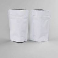 two empty white stand pouches with zipper openings held wide