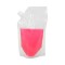 clear spoutpak pouch filled with pink liquid 
