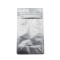 Packs down flat for more efficient transport silver flat bottom bag with pocket zipper lying flat on white table