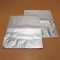 packs flat before use two silver stand pouches flat on wooden table