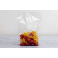 2 vacuum bags with green and yellow beads inside the left pouch and purple beads in the right pouch