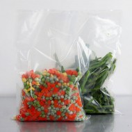 two high barrier QX pouches with green and yellow beads in left pouch and purple beads in right pouch