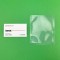 small clear vacuum pouch next to business card