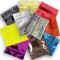 pile of yellow, gold, red, blue, orange, purple, brown, black, silver and holographic mini zipper pouches