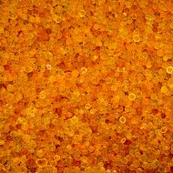 Tin full of bright orange desiccant beads