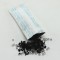 black carbon and gilica gel beads spilling from packet