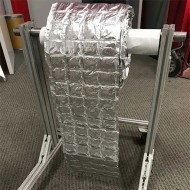 suspended roll of 4 pouches by 40 feet ready to be cust and dispensed