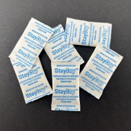piles of .25g non indicating silica gel packets