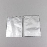 two silver foil pouches empty with tear notch