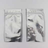 two flat silver mylar zipper closure poouches that are filled and sealed at the bottom