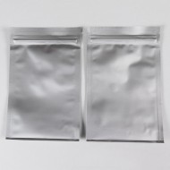 two silver mylarfoil fill through bottom pouches, with tear notch and tamper evident zipper closure