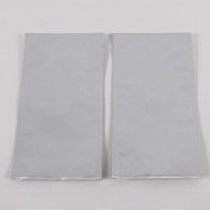 two empty white foil PET pouches with tear notch
