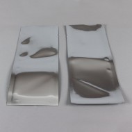 two silver barrier 3-side seal pouches with tear notches on both end