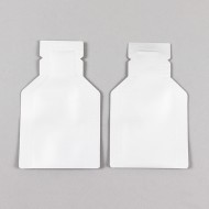 two white die-cut dispenser tip pouches
