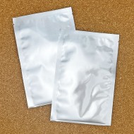 two shiny silver foil pouches with easy loading lip