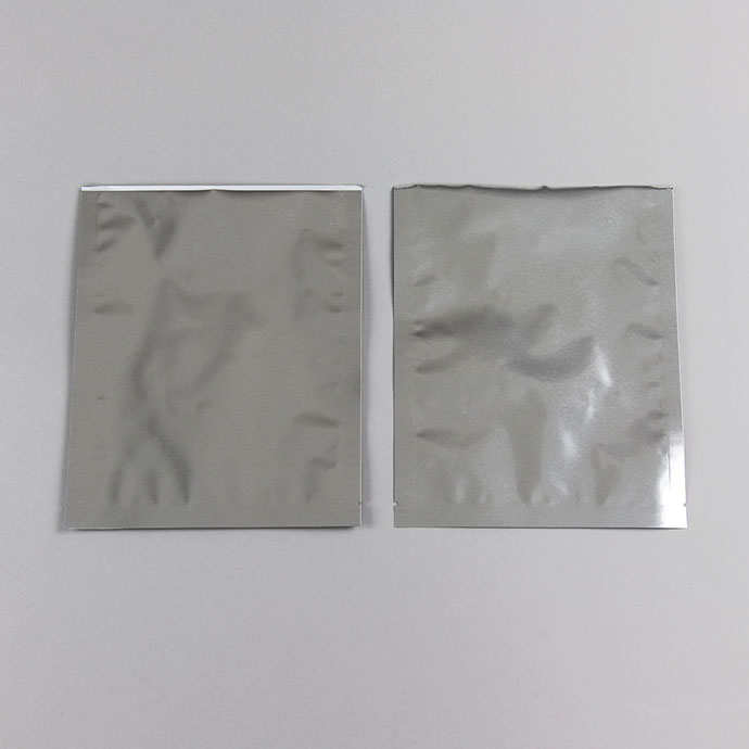 065MFS08BTNL mylarfoil 3-side seal pouches with thin tear notch two silver foil minipouches empty with open bottom