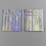 two stripped holographic minipouches laying empty