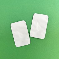 White Mylar Write On Pouches 2 x 3 inches Two empty white foil mini pouches with tear notch and rounded corners