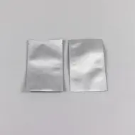 two empty silver foil minipouches with tear notch