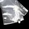 small clear pouch filled with syringe