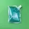 small clear spout pouch filled with blue liquid