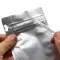 pocket zipper pull tab cleanly opens the pouch hands tearing off strip halfway