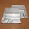 two silver stand pouches flat on wooden table