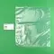 12 x 14 Clear Vacuum Bag next to business card