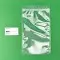 clear zipper vacuum bag next to business card