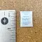 0.25 Gram Molecular Sieve Desiccant Packet next to ruler