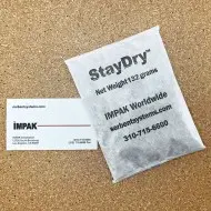 4 unit clay desiccant packet next to business card