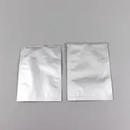 two silver foil pouches empty with tear notch