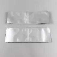 two empty silver frangible seal pouches
