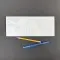 white pouch next to pen and pencil