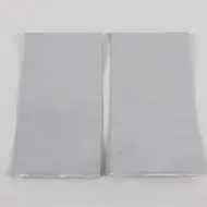 two empty white foil PET pouches with tear notch