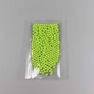 open bottom clear pouch filled with yellow beads