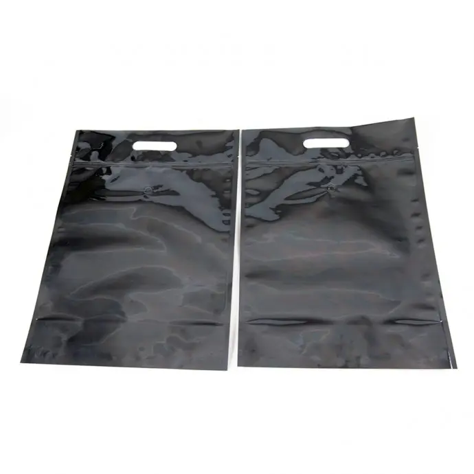 R70MB07ZHV - black stand pouch with valve, zipper, handle and tear notch two black stand pouches flat and empty