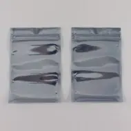 two side by side grey pouches