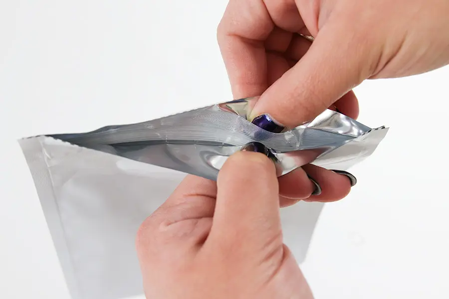 thumb-pocket bag being opened