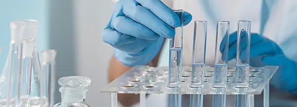 freepik image close up of scientist hands pouring beakers in a cleanroom